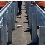 Thrie beam crash barrier installation